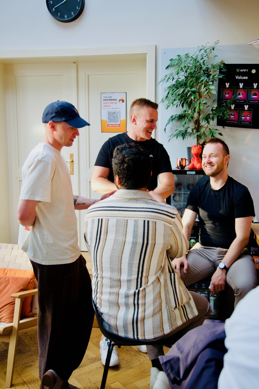 After-talk conversations next to the Apify values wall